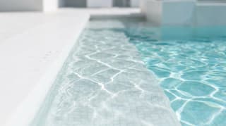 Clear pool water over tiled steps