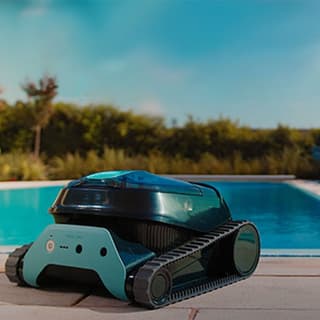 Dolphin Liberty 200 cordless robotic pool cleaner in a backyard pool