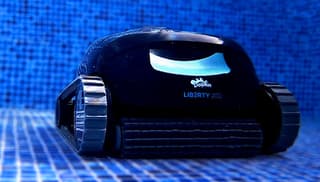 Dolphin robotic pool cleaner with commercial-grade motors working in a large pool