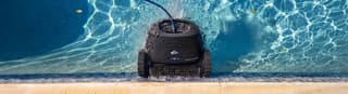 Spotless backyard pool kept clean by a robotic pool cleaner